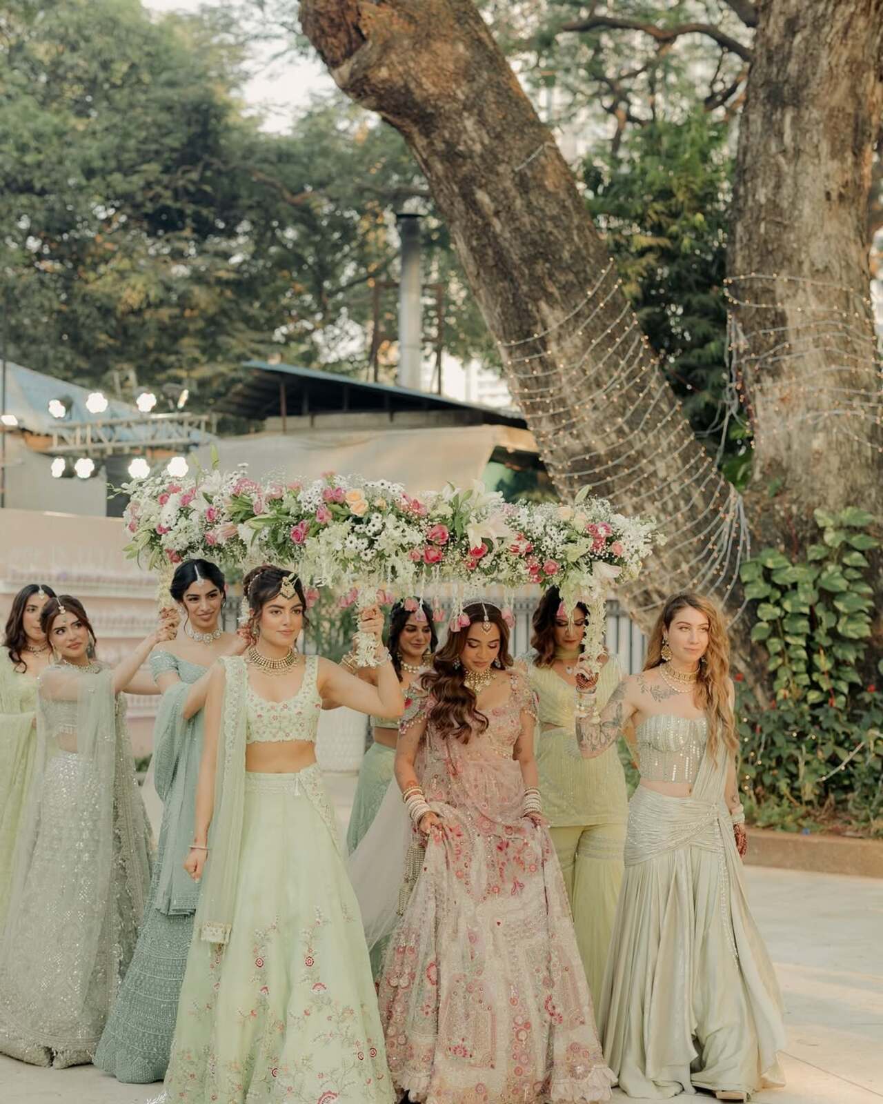 The bride could be seen wearing a bespoke lilac lehenga, as her bridesmaids including actress Khushi Kapoor accompany her to the mandap. 