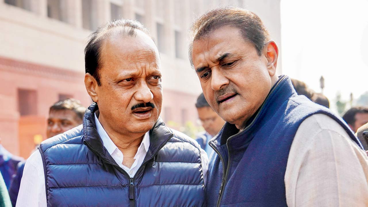 Maharashtra Deputy Chief Minister Ajit Pawar with NCP MP Praful Patel in New Delhi on Thursday. Pic/PTI 