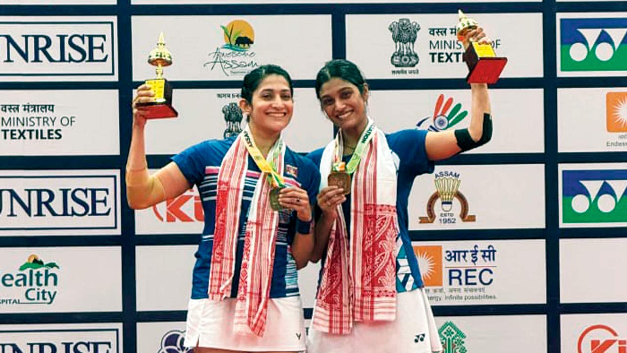 Women’s doubles champions Ashwini Ponnappa (left) and Tanisha Crasto with their trophies 