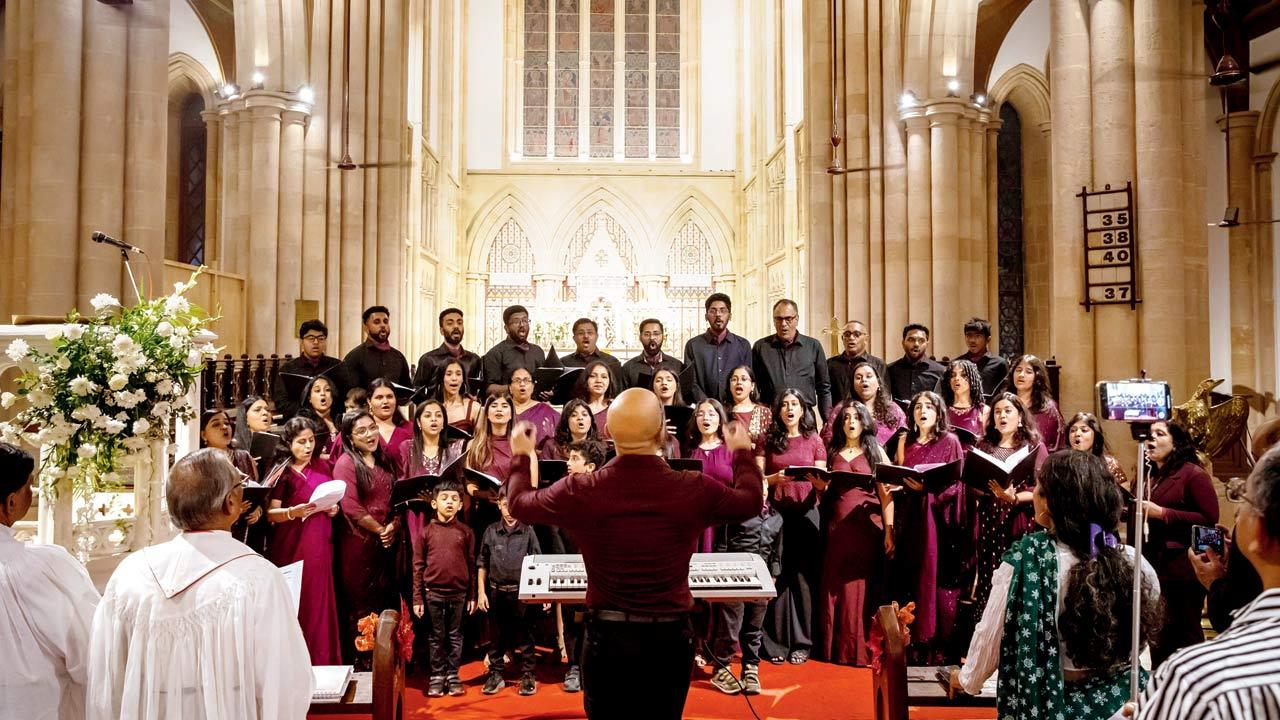 The choir performs the Indian National Anthem during the midnight mass on  Christmas Eve at the recently restored Afghan Church 