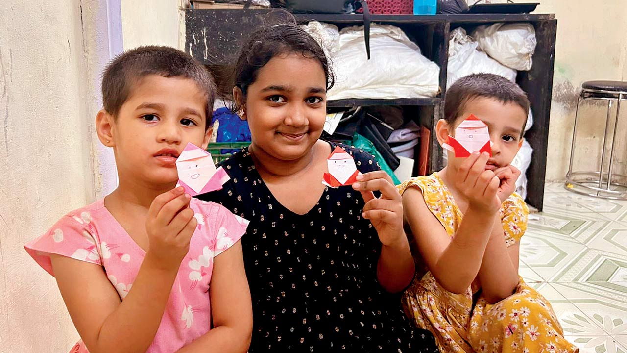 Children show off their handcrafted pieces after the session 