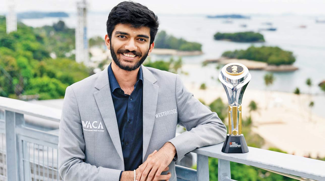 India’s D Gukesh with the FIDE World Chess Championship trophy in Singapore on Friday. Pic/PTI 