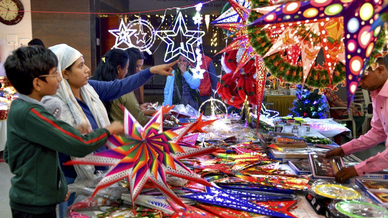 People shop decorative items ahead of Christmas celebration, in Ahmedabad on Monday