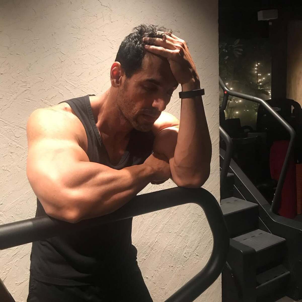 John Abraham is a fitness freak and loves sports. He is often seen in a tank top while working out or enjoying his favourite sports. This black tank top adds to John's hotness and highlights his ripped body, especially his biceps and triceps. 