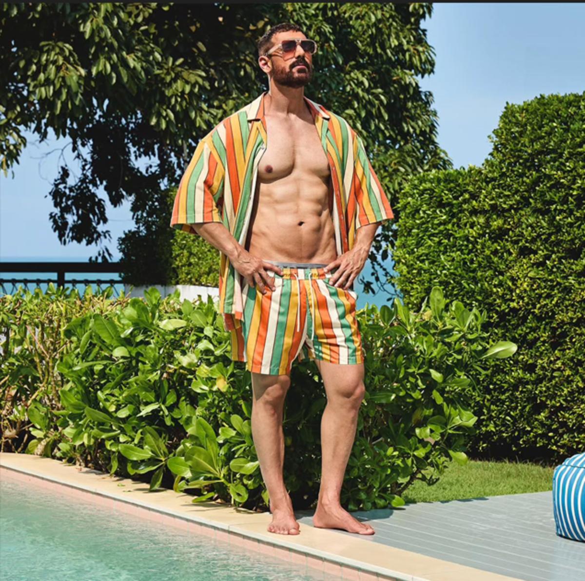 John Abraham relaxes in this comfortable yet chic multicoloured co-ord set. It has hues of orange, green, and beige.