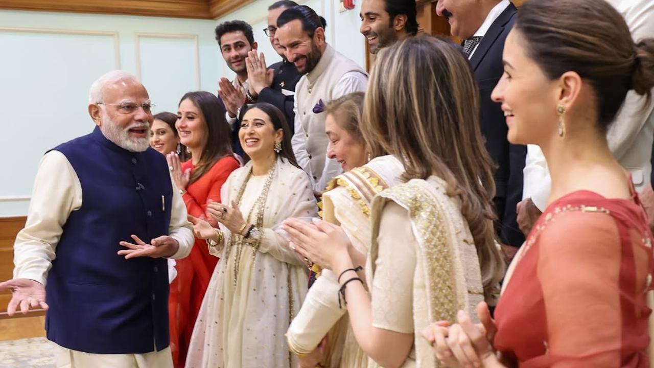 Bollywood's Kapoor khandaan meets PM Narendra Modi, Kareena gets autograph for Tim and Jeh. Read more