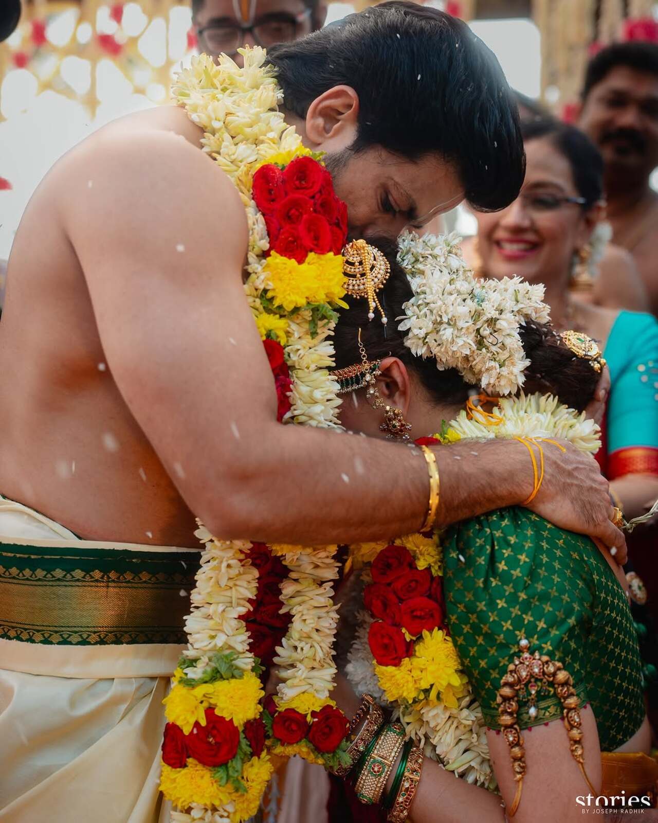 The photos show the couple putting garlands on each other as their relatives and loved ones cheered for them. A priest performed the rituals