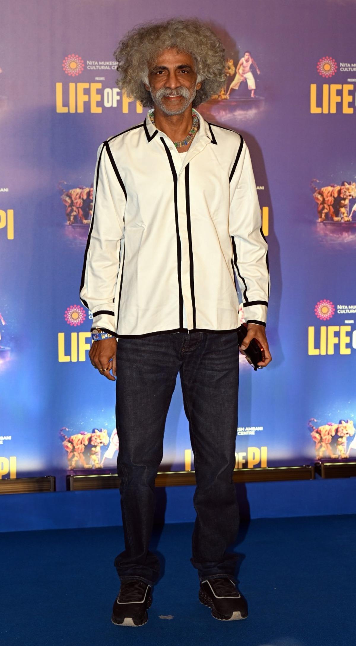 Makrand Deshpande was spotted at the premiere of Life of Pi. The 'Monkey Man' actor was seen dressed in a white shirt with black borders and blue denim.
