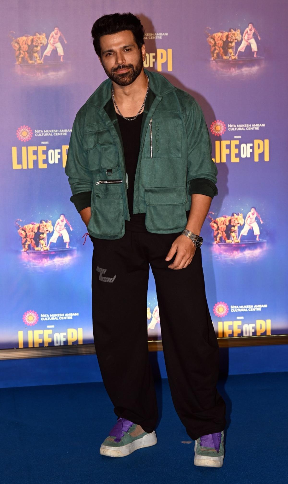 Popular TV actor and host Ritwik Dhanjani was also papped at the grand premiere of the musical. The actor was wearing an army green jacket with black bottoms and colourful sneakers.