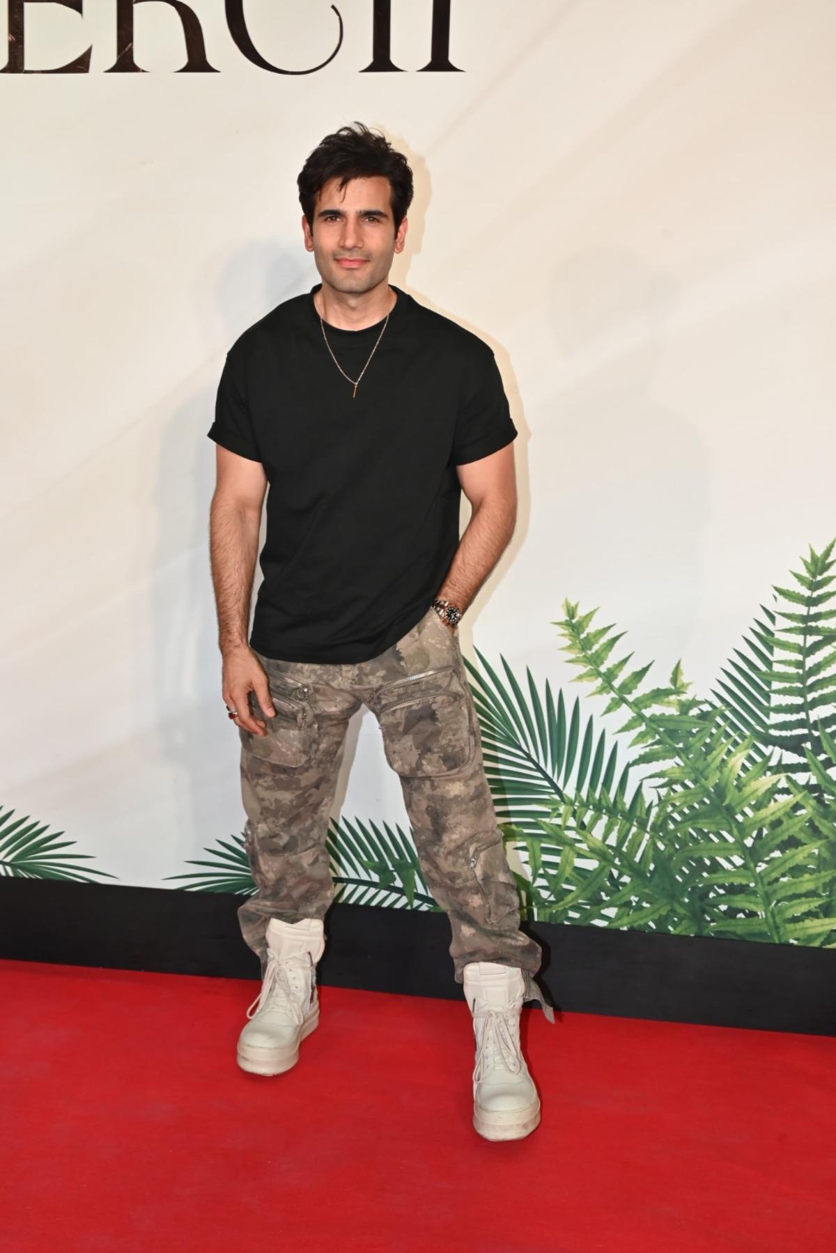Actor and model Karan Tacker was also snapped at the restaurant. He was wearing a simple black tee with army-coloured pants and white sneakers.