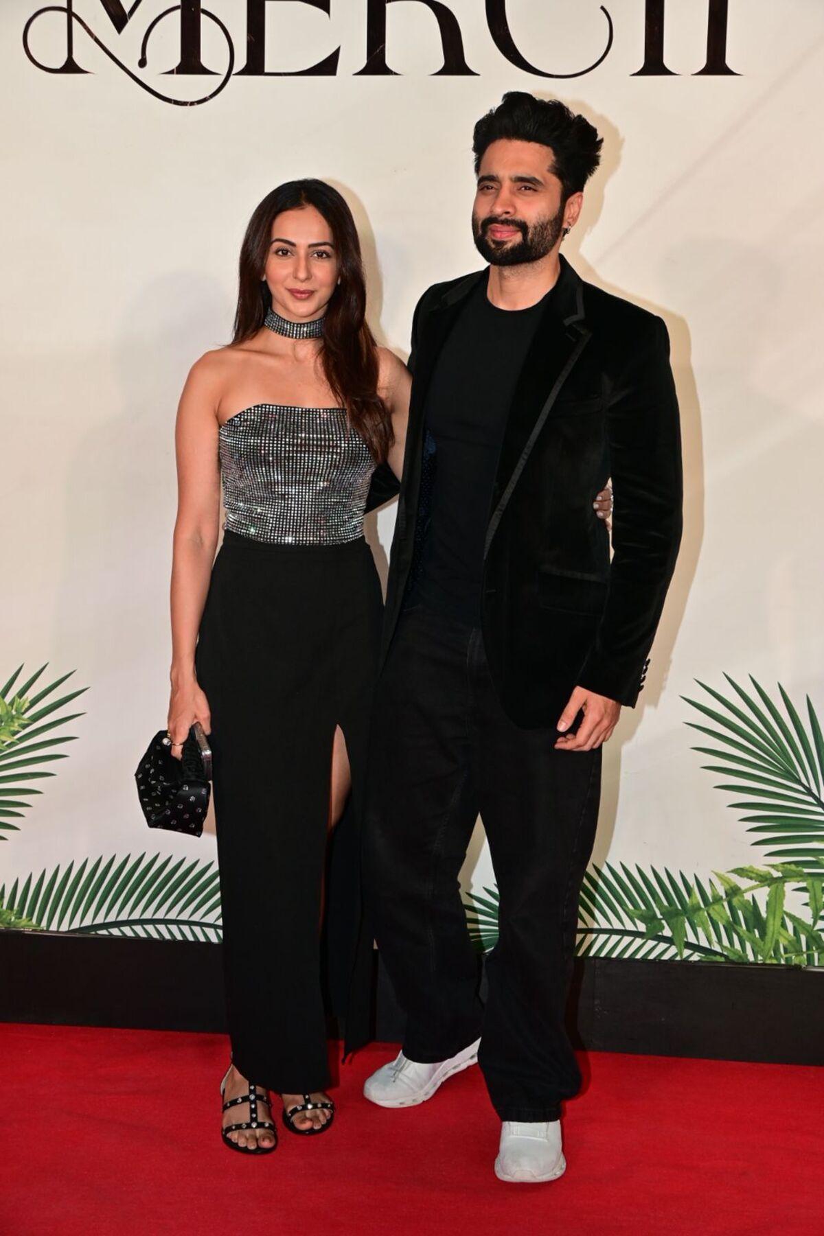 Rakul Preet Singh and Jackky Bhagnani were papped at Arpita Khan's new restaurant Mercii. Rakul was wearing a blingy silver off-shoulder top with black pants and accessories. Whereas, her husband, Jackky Bhagnani was dressed in an all-black coat and pant suit.