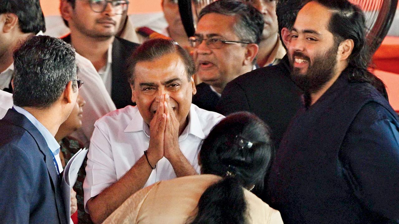Industrialist Mukesh Ambani along with his son Anant at the swearing-in ceremony. Pics/Rane Ashish