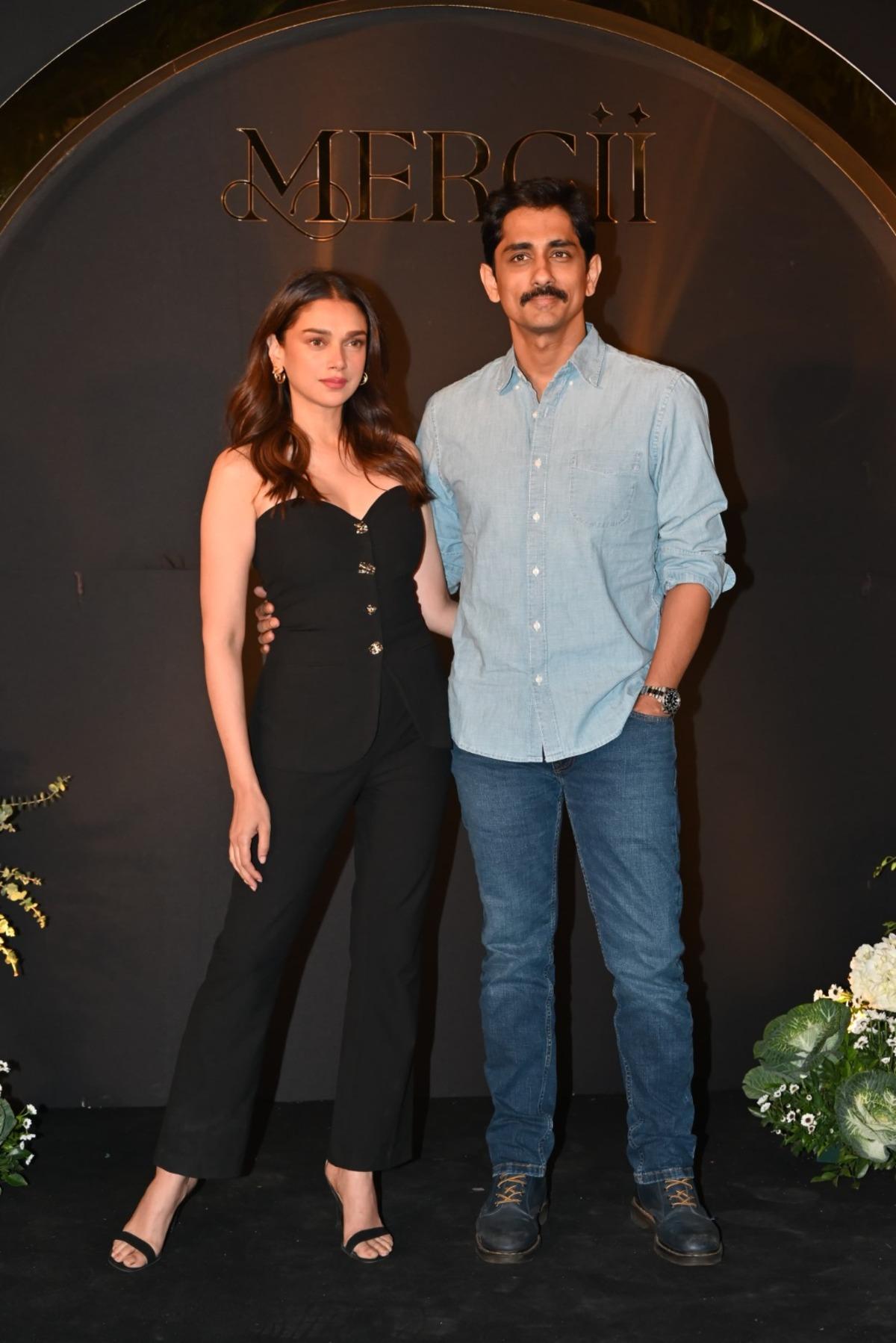 Aditi Rao Hydari was spotted with her husband Siddharth in a cool fit for the birthday party. She was wearing an off-shoulder buttoned top with black pants and heels. Whereas Siddharth kept it casual in a light blue shirt and blue denims.