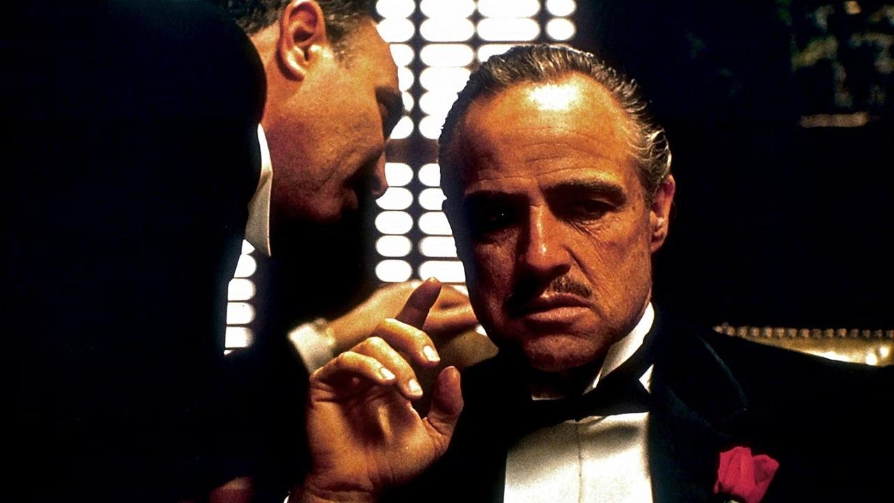 The Godfather (1972)
At least part of the film has Christmas settings. In fact one of the most pivotal parts, occurs during the Christmas holidays: the scene early in the film where Don Corleone (played by Marlon Brando) is shot by rival gangsters.