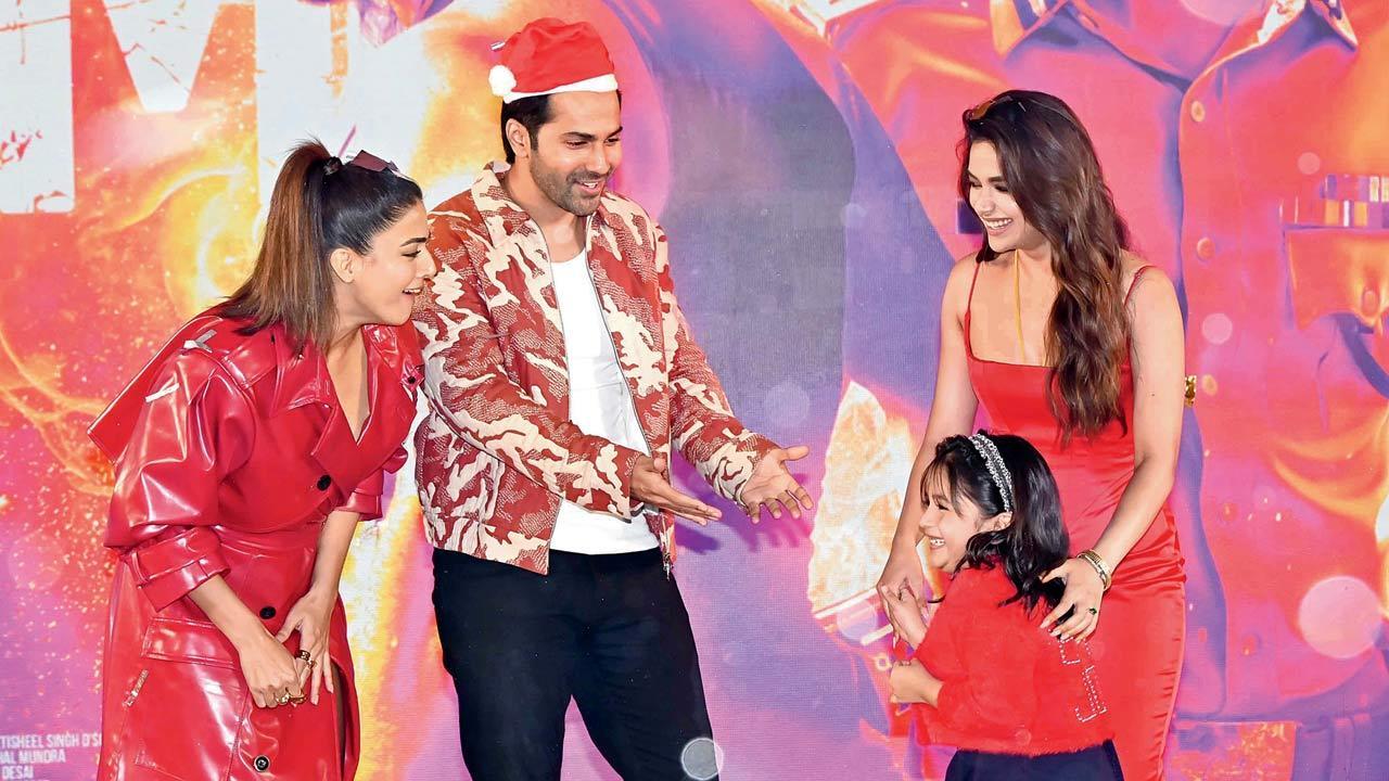 Up and about: Varun Dhawan plays Santa with Baby John child actor Zara