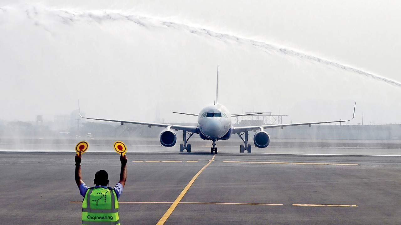 The very first test touchdown at the Navi Mumbai International Airport tarmac by a commercial Airbus A320 aircraft this month. Pic/Nimesh Dave