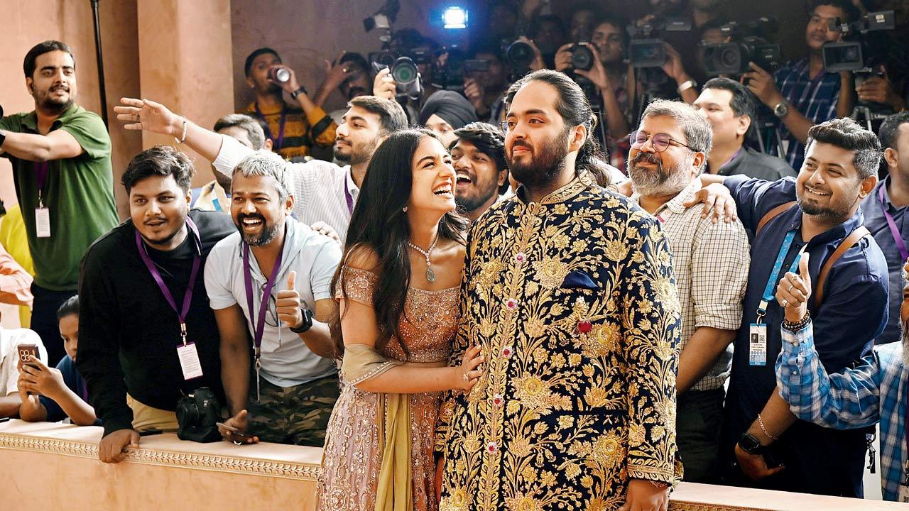 Anant Ambani and Radhika Merchant pose for photographs with media persons during their sangeet ceremony at Jio World Centre, BKC. Pic/Satej Shinde