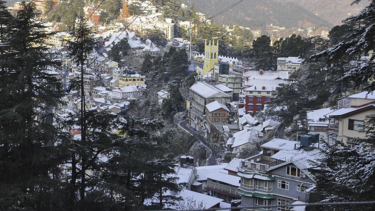 Shimla, along with the nearby tourist resorts of Kufri, Fagu, Chansel, Narkanda and the Churdhar ranges, as well as several high mountain passes, received the first snowfall of the season on Sunday evening, breaking a ten-week dry spell and bringing cheer to the farmers, apple growers and hoteliers. (In Pic: Snow covered houses and buildings after fresh snowfall in Shimla, Himachal Pradesh)