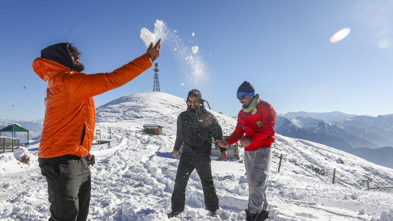 Tourists enjoy after fresh snowfall in Udhampur district, Jammu & Kashmir. (Pic/ PTI)