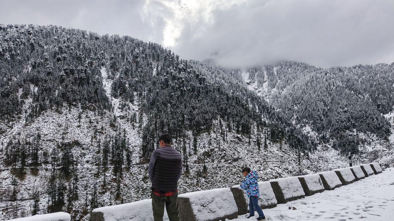 Tourists enjoy after a fresh spell of snowfall, at Bani in Kathua district. (Pic/ PTI)