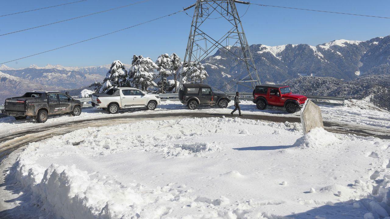 Tourists enjoy after fresh snowfall, at Patnitop hill station in Udhampur district, Jammu & Kashmir. (Pic/ PTI)
