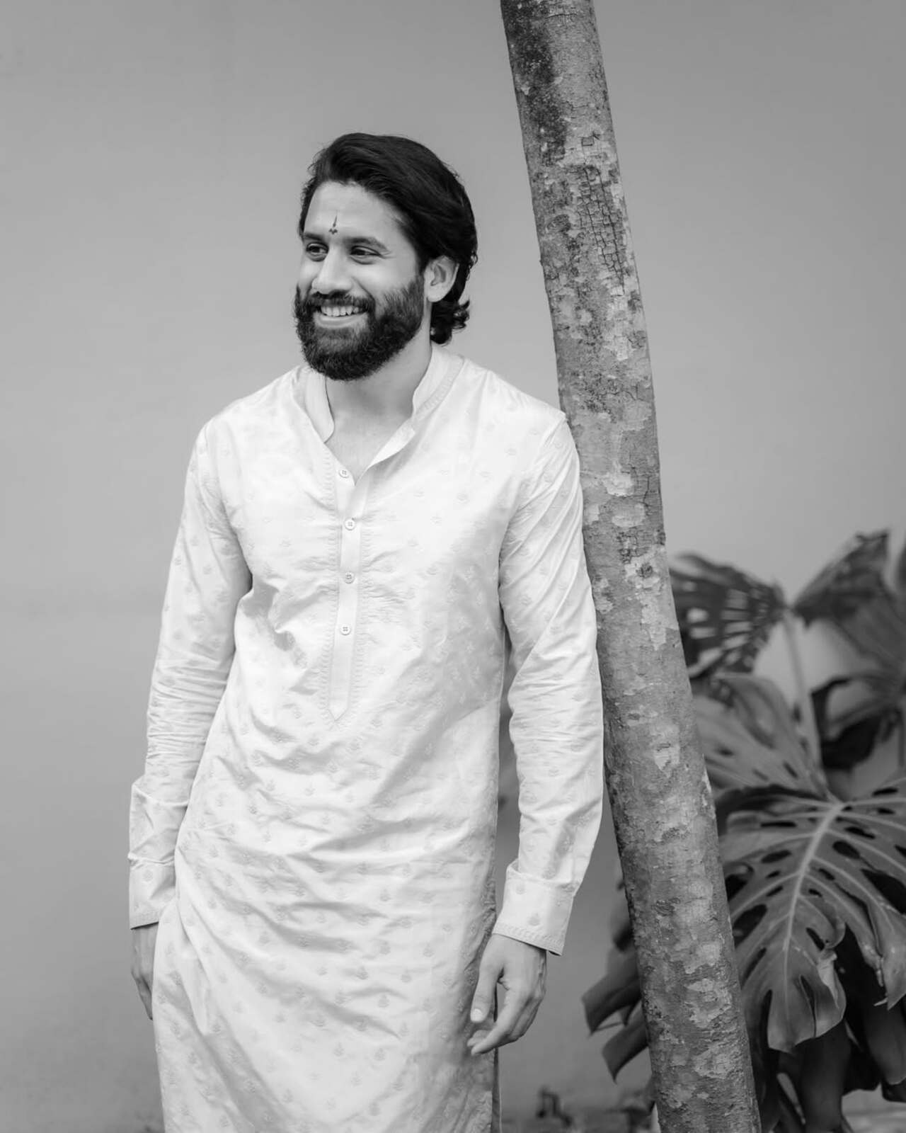 Naga, dressed in a traditional pancha (dhoti), appeared deeply engaged in the sacred rituals. 