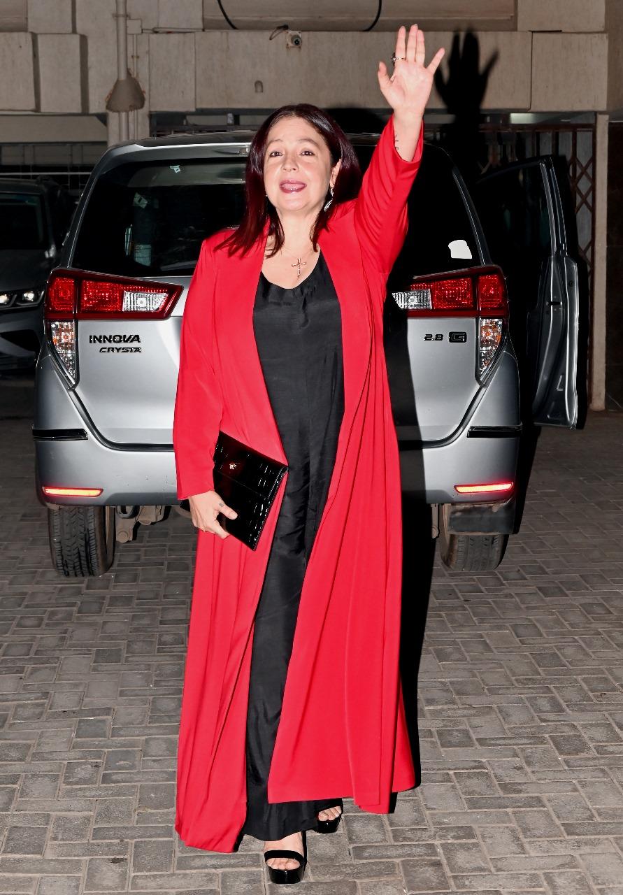 Pooja Bhatt waved at her father as she smiled ear to ear upon arriving at his residence for the intimate Christmas party.