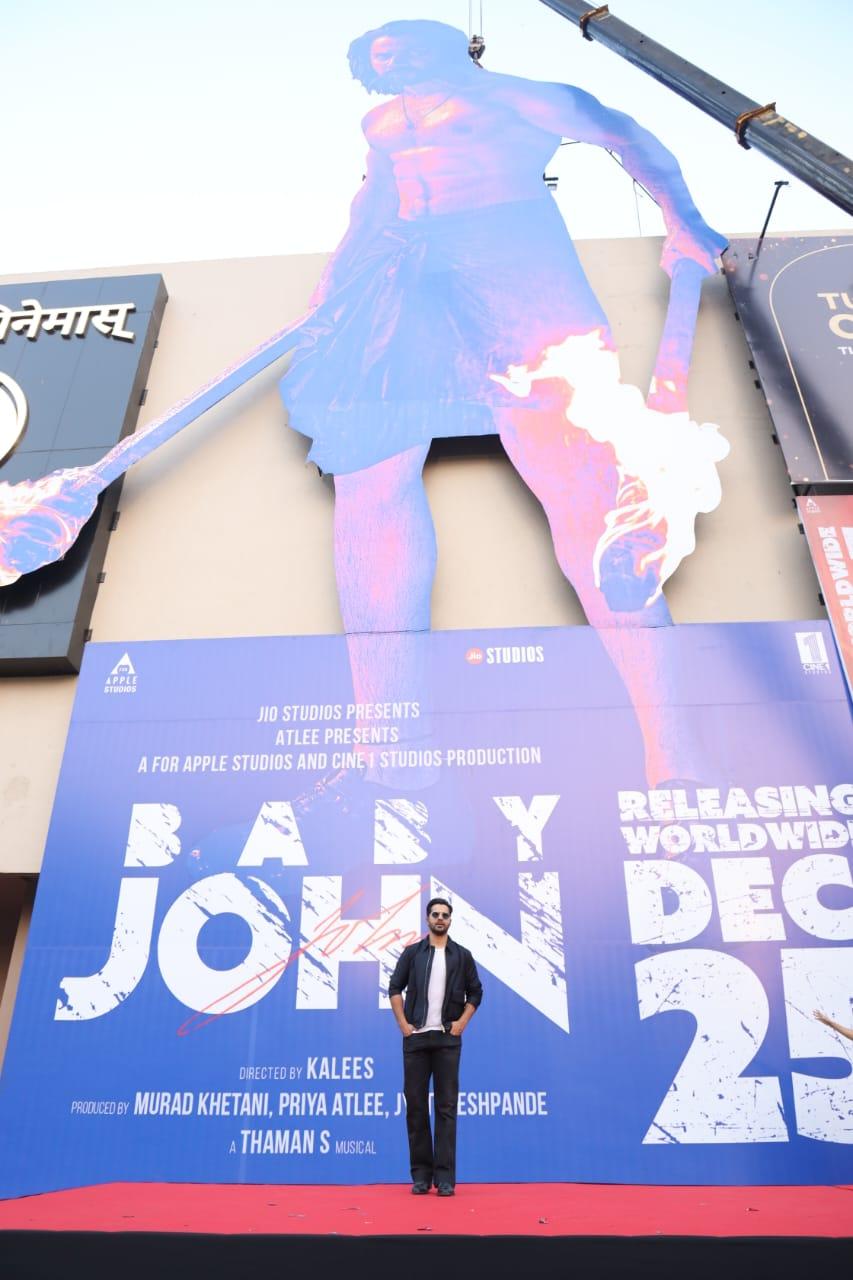 Varun Dhawan and producer Murad Khetani from Cine 1 studios unveiled a massive 100 ft poster of Baby John outside a cinema hall today