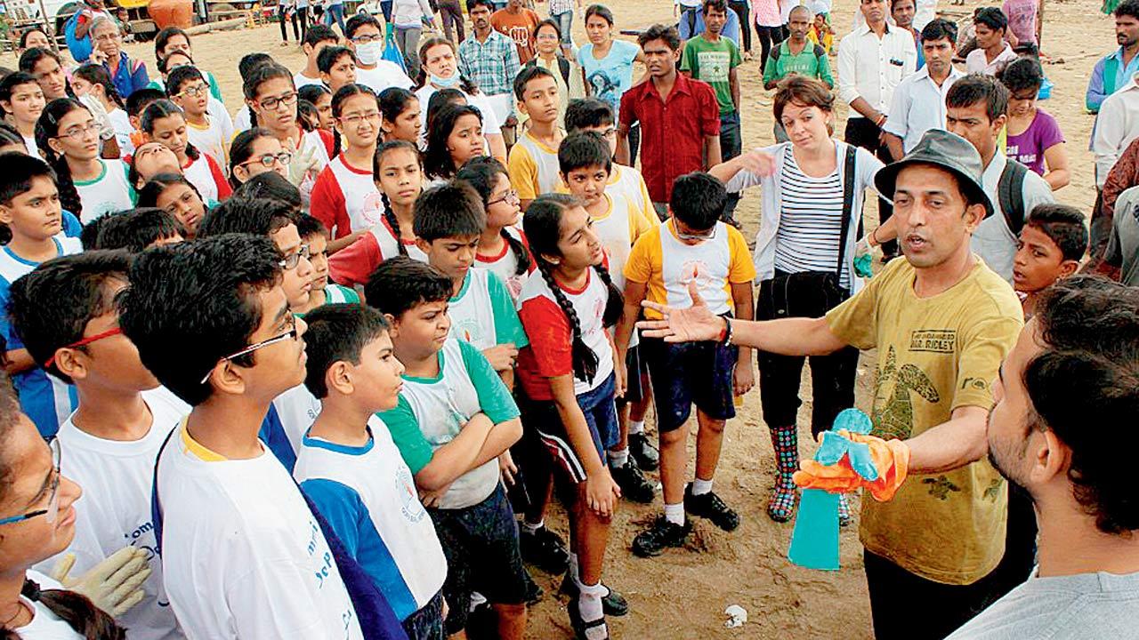 Anand Pendharkar, author and founder-CEO of SPROUTS, leads a clean-up drive at Girgaum Chowpatty