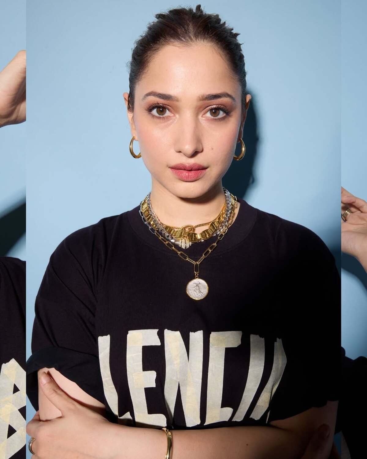 Tamannaah aces this casual fit with a cool demeanour. She tied her hair in a bun and paired golden and silver chunky neckpieces. 