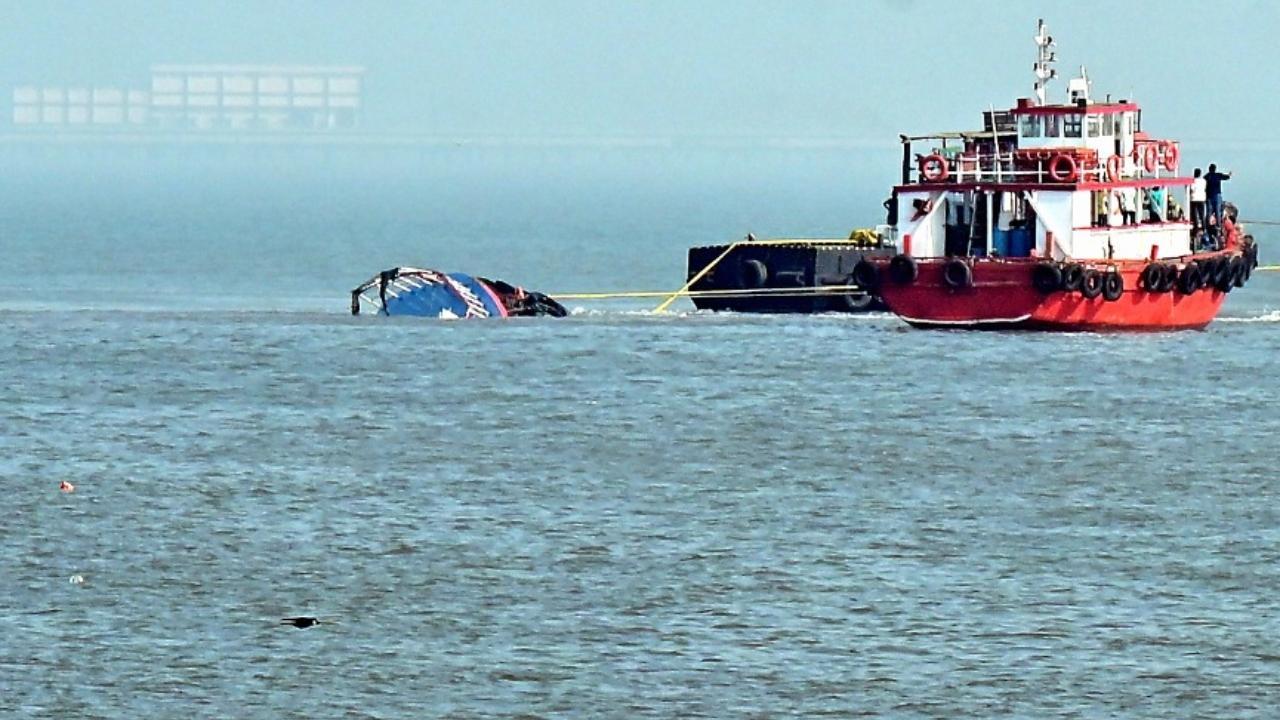 IN PHOTOS: Tugboats used to pull out ferry capsized after collision