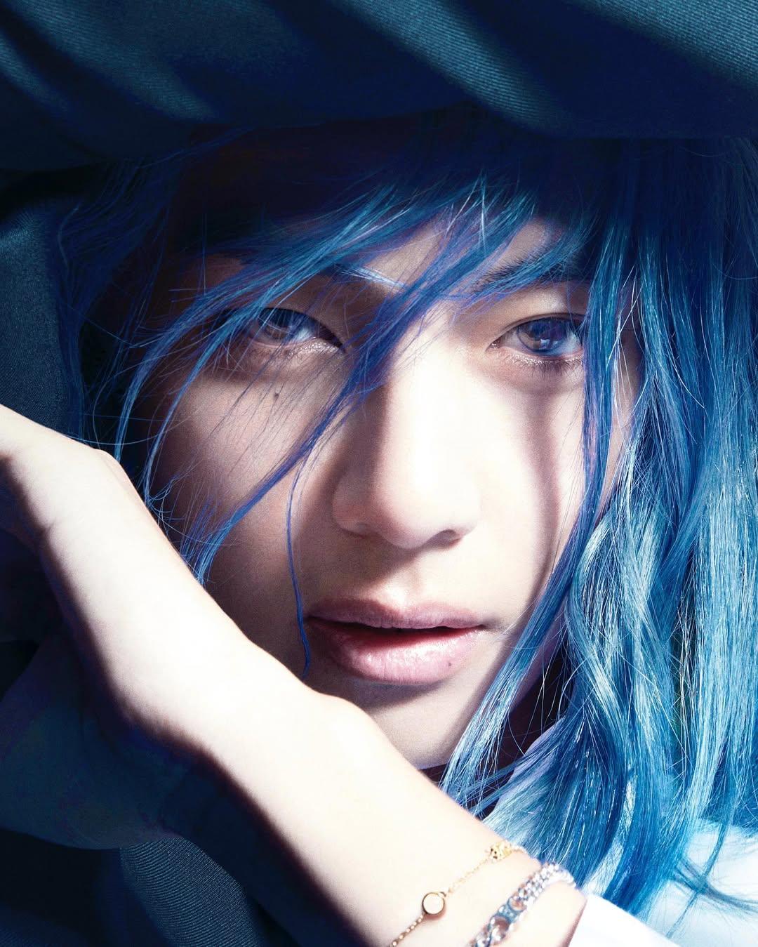 Long hair and blue eyes - V can work magic when it comes to fashion. He seamlessly transforms from boy-next-door to a fantastical creature during this photoshoot for Harpers Bazaar Korea