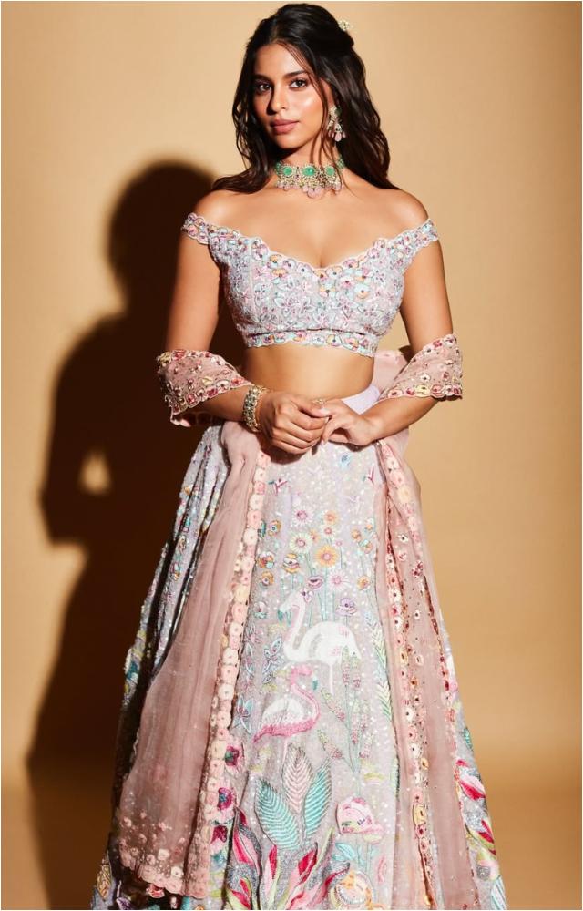 She charmed in a white and pink lehenga featuring intricate animal and floral motifs
