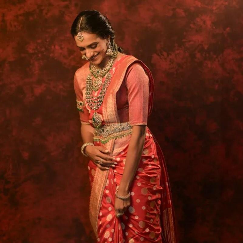 During one of the festivities, PV Sindhu stunned in a red Kanjivaram saree, which she paired with intricate jewellery