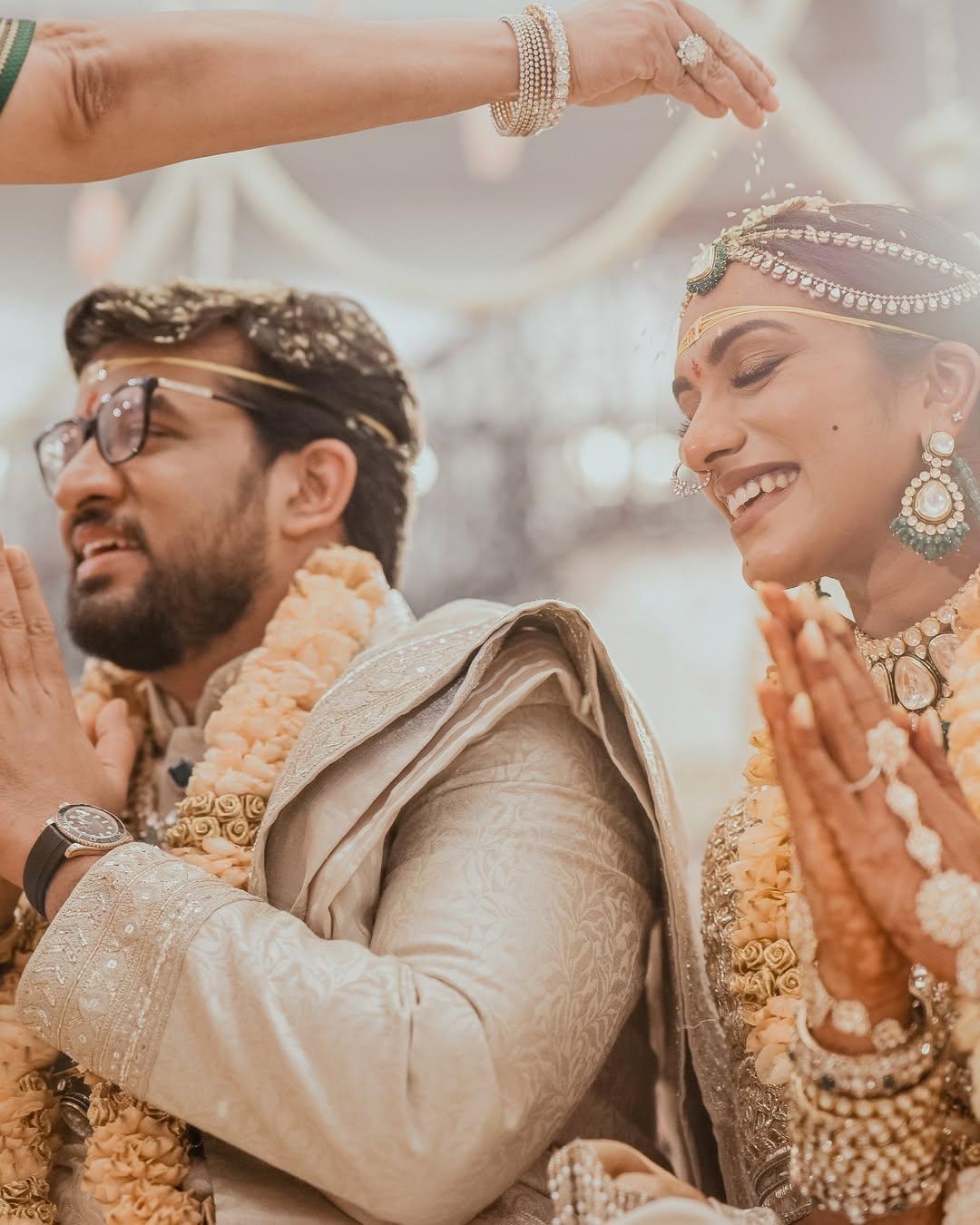 For her wedding ceremony, Sindhu wore a gorgeous cream-colored saree by Manish Malhotra, and her groom matched her in a similarly colored sherwan