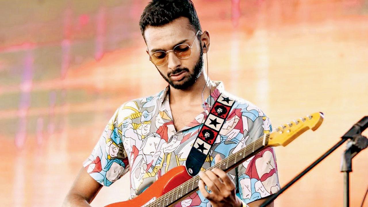Adesh Vinod plays the guitar. Pic Courtesy/Instagram