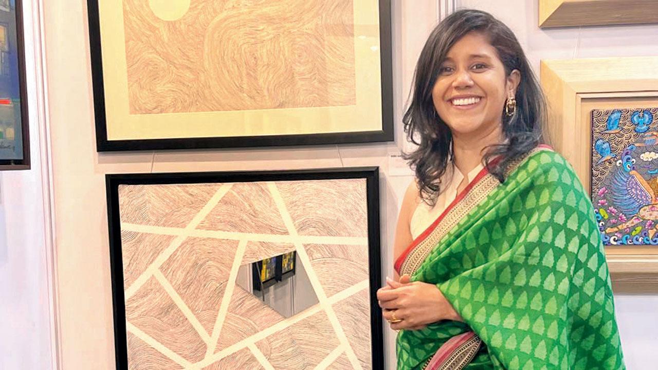 Aditi Surana with her works at the gallery