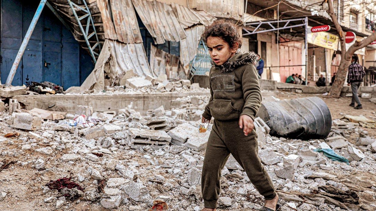  A girl walks through the rubble after Israeli bombardment in Rafah. Pic/AP