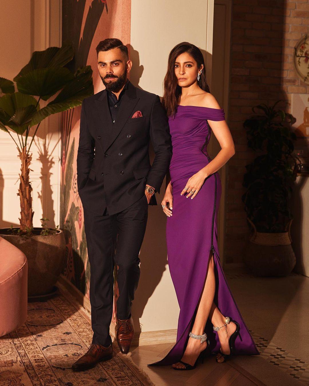 For this look, Anushka wore a stunning off-shoulder, body-hugging purple dress, while Virat slayed in a black three-piece suit