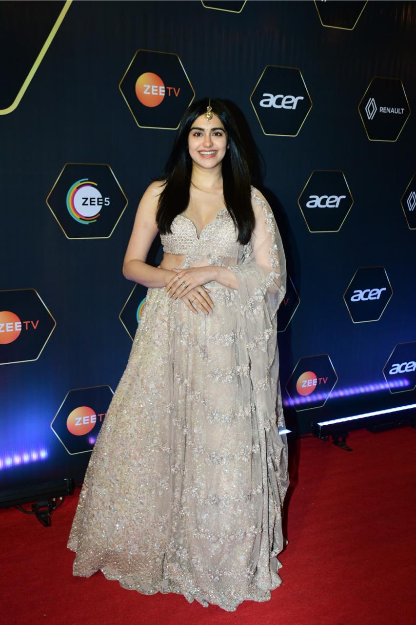 Adah Sharma was a sight to behold in her latest ethnic look. She was spotted wearing a stunning beige-hued lehenga that accentuated her beauty even more. The ensemble included an infinity choli that was intricately designed and a sheer dupatta. The lehenga was adorned with beautiful embroidery work that was done on the fabric using intricate and delicate threadwork. 