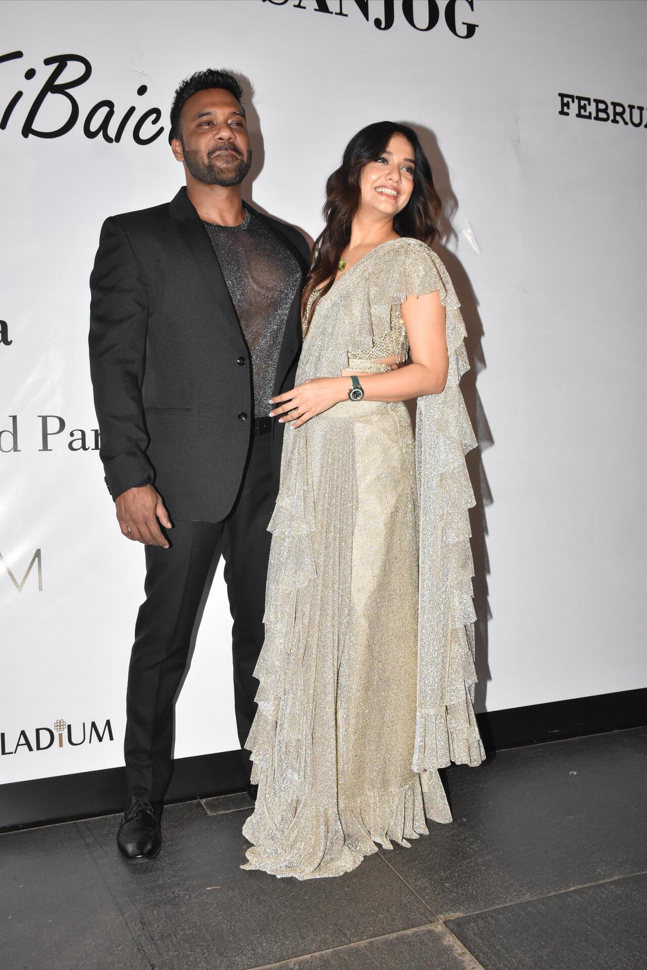 Lovebirds Divya Agarwal and Apurva Padgaonkar posed for the paparazzi on their cocktail night with the former wearing a shimmery saree, and the latter keeping it classy in a black suit
