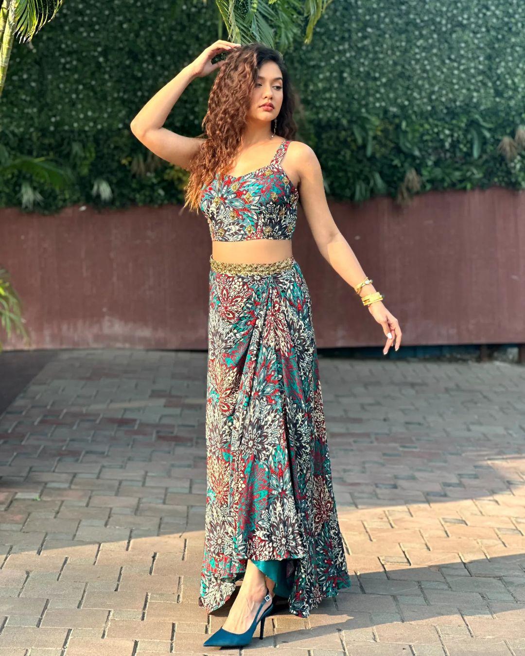 Divya donned this beautiful multicolour co-ord skirt set and added curls to her hair, which makes her look ravishing