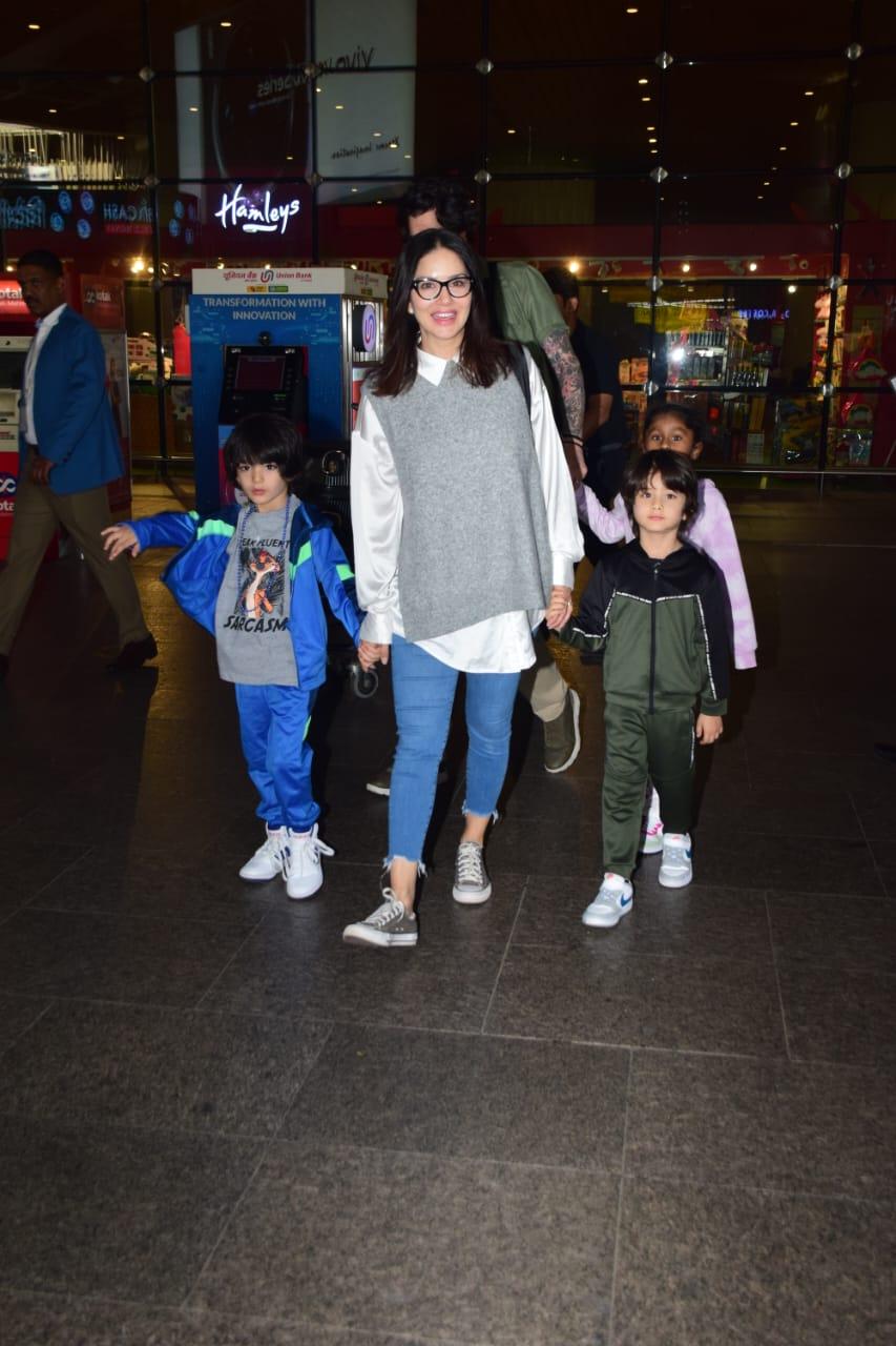 Sunny Leone was clicked at the airport as she arrived in the city with her kids
