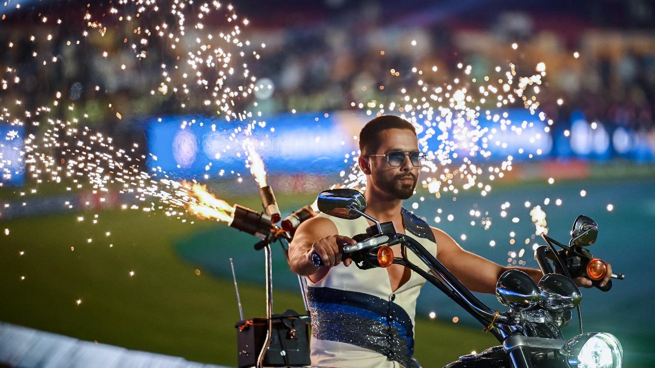 Bollywood actor Shahid Kapoor (R) performs for the opening ceremony of 2024 Women's Premier League (WPL) before the start of first Twenty20 cricket match between Mumbai Indians and Delhi Capitals