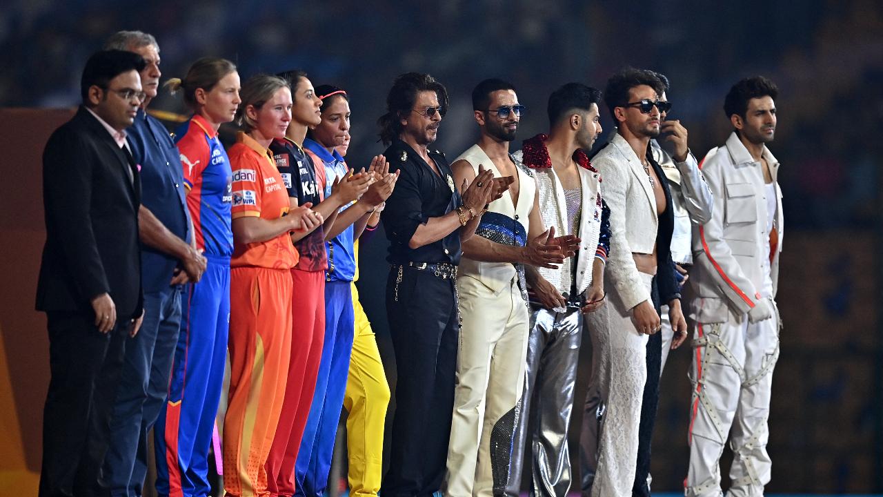 WPL teams' captains and Bollywood actor Shah Rukh Khan (C) attend the opening ceremony of 2024 Women's Premier League (WPL) before the start of first Twenty20 cricket match between Mumbai Indians and Delhi Capitals 