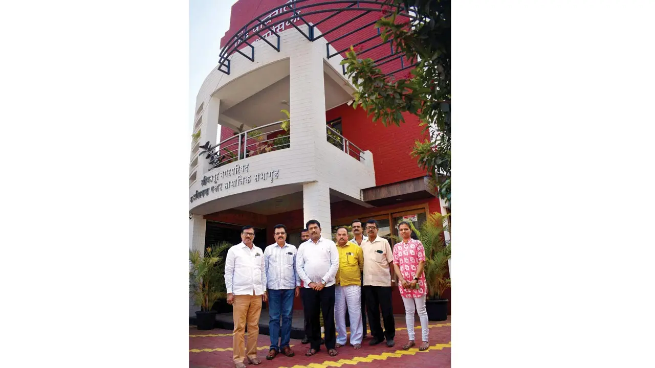 The trustees and staff of the Hind Vachanalaya; the latter work 12-hour shifts to keep the library running