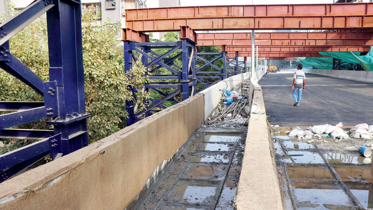 Cement curing work on Gokhale bridge. Pic/Anurag Ahire