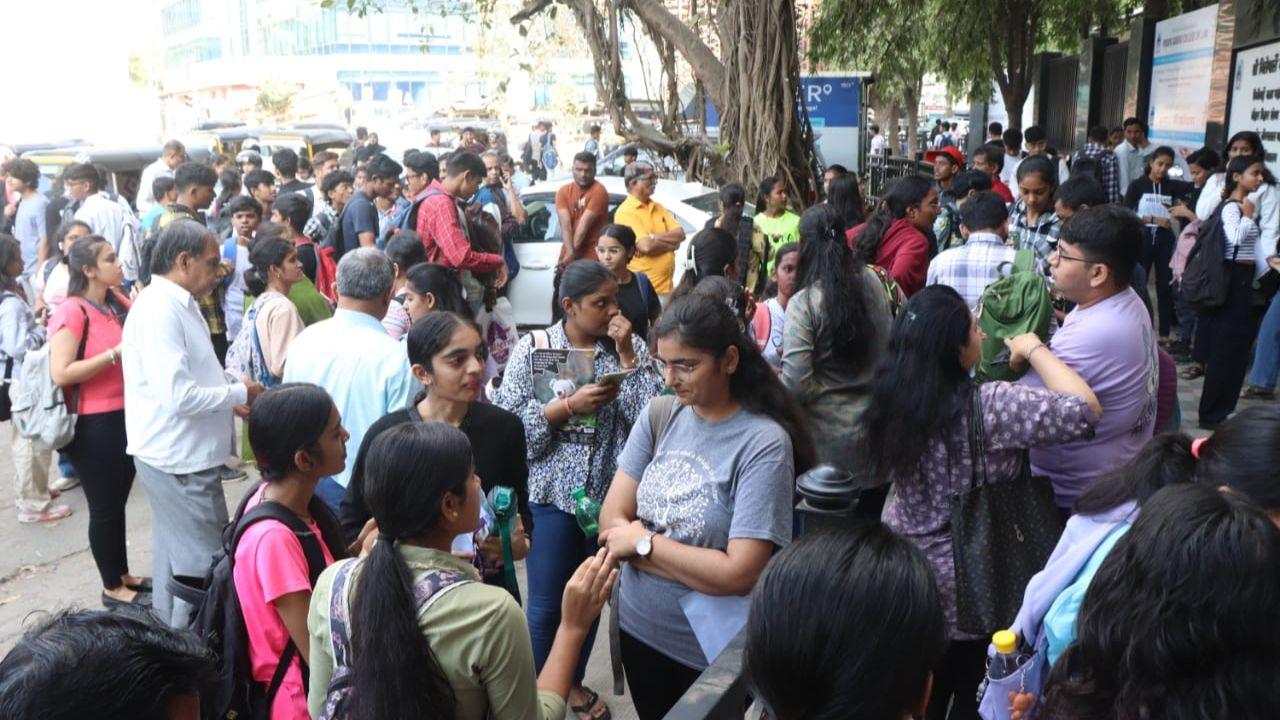 Visuals showed scores of students lined up outside their designated examination centres as they revised moments before their test. 