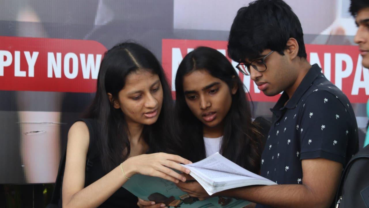 Some students could be seen looking up a chart that displays their seating arrangement for the duration of today's test. 