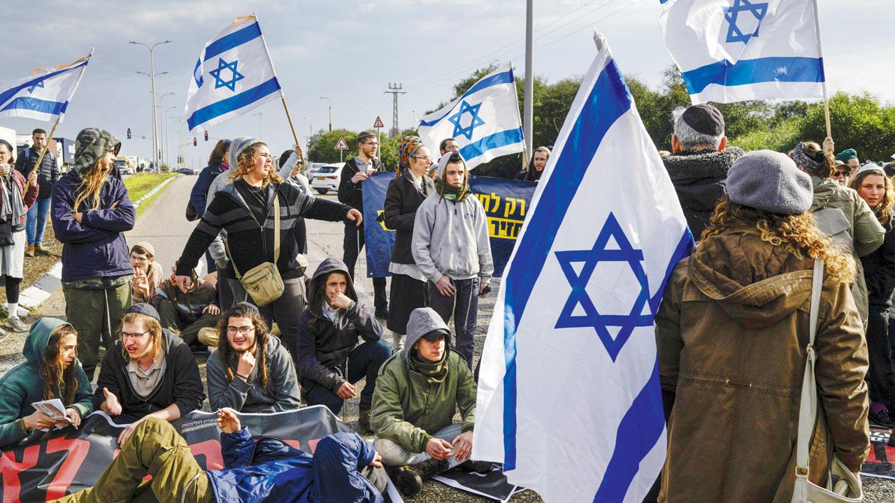 Israeli activists block the exit of Ashdod port to stop trucks carrying aid for Gaza Strip